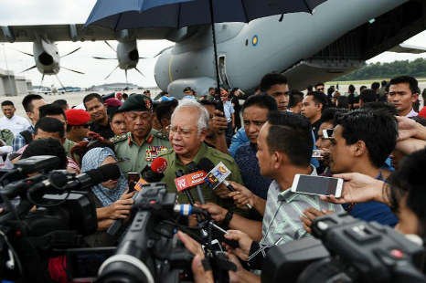 Malaysia's Prime Minister Najib Razak speaks to journalists during the deployment of humanitarian aid for Rohingya refugees to Chittagong.