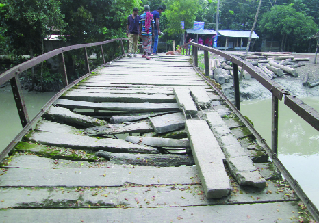DASHMINA (Patuakhali): The dilapidated bridge over Borgi canal at Dashmina Upazila needs immediate repair as thousands of people of the Upazila facing problems for long time . This snap was taken yesterday.