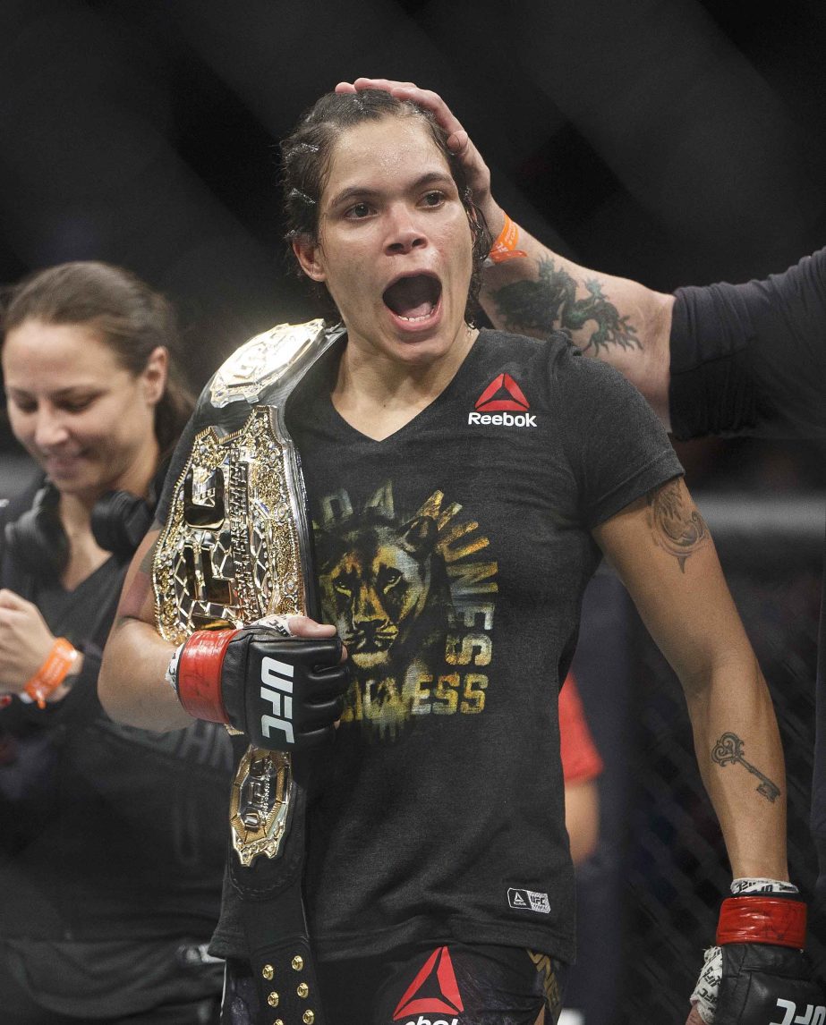 Amanda Nunes of Brazil, celebrates after defeating Valentina Shevchenko of Kyrgyzstan, during their mixed martial arts bout at UFC 215 in Edmonton, Alberta on Saturday.