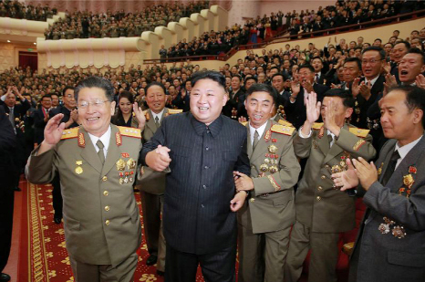 North Korean leader Kim Jong-Un (front, 2ndL) attends an art performance dedicated to nuclear scientists and technicians at the People's Theatre in Pyongyang.