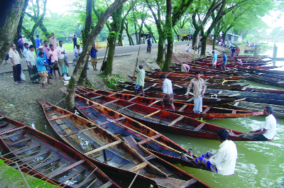 SYLHET: Boat traders at Goyainghat passing busy time at the weekly haat on Saturday.