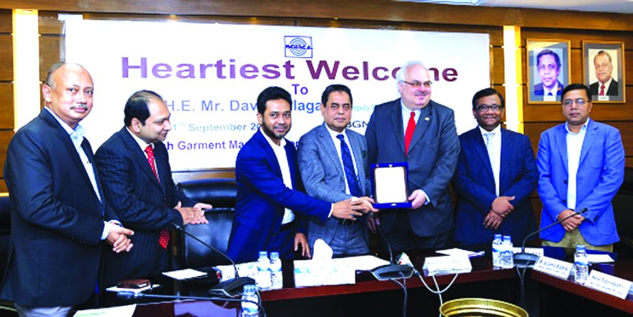 Siddiqur Rahman, President of BGMEA, handing over a crest to David Jalagania, Deputy Foreign Minister of Georgia at BGMEA office in the city on Monday. Md. Nasir, Vice-President (Finance), directors of the association and Md Allama Siddique, Turkish ambas