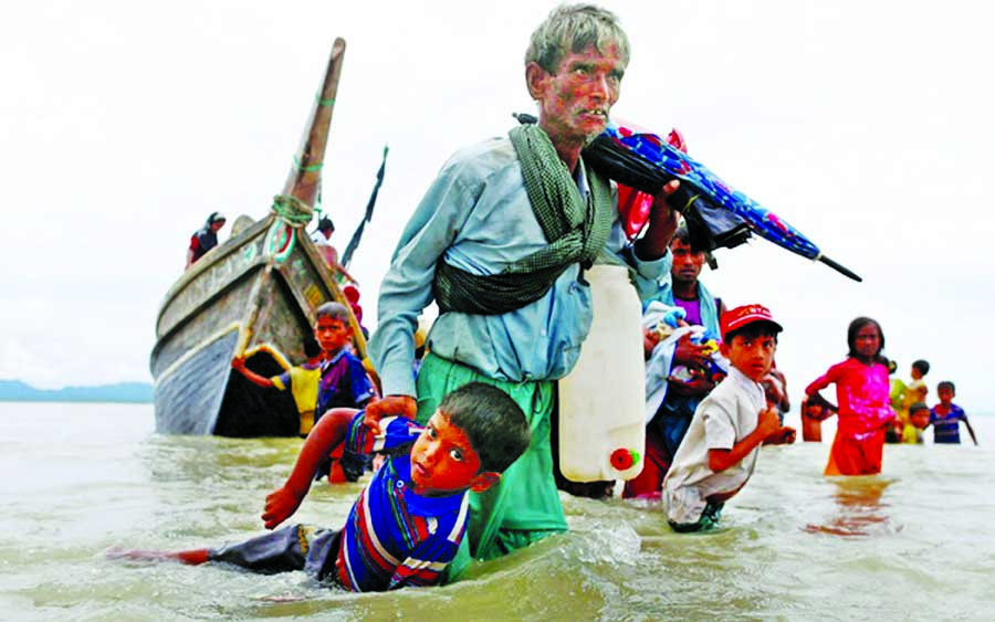 Rohingyas continue to arriving by boats as well as crossing the land border at numerous points everyday. This photo was taken from the bank of River Naf on Monday.