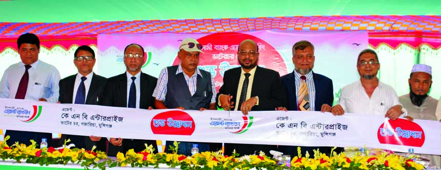 Abu Reza Md. Yeahia, DMD of Islami Bank Bangladesh Limited, inaugurating its third agent banking outlet in Bhaterchar Bazar of Gazaria upazila in Munshiganj on Sunday. Dr. Muhammad Kamaluddin Jasim, Head of Dhaka East Zone, Mohammad Jamal Uddin Mazumder,