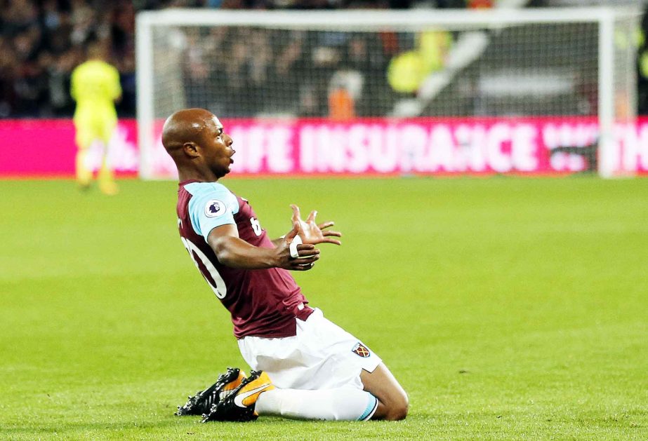 West Ham's Andre Ayew celebrates after scoring his side's second goal during the English Premier League soccer match between West Ham United and Huddersfield Town at London Stadium in London on Monday.