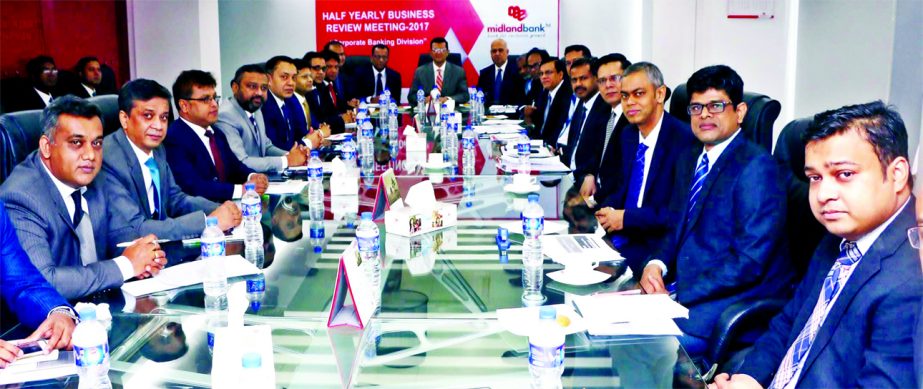 Ahsan-uz Zaman, Managing Director of Midland Bank Limited, presiding over its Half Yearly Corporate Banking Business Conference- 2017 at its head office in the city on Wednesday. Masihul Huq Chowdhury, AMD, Khondoker Nayeemul Kabir, DMD and Md. Zahid Hoss