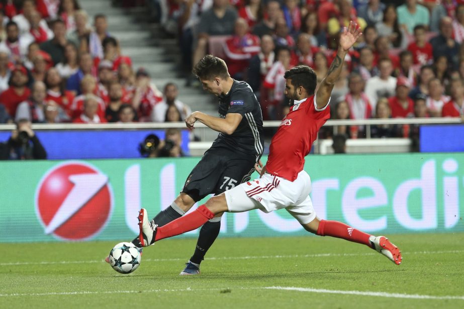 CSKA's Timur Zhamaletdinov, rear, challenges for the ball from Benfica's Ljubomir Fejsa, right, during the Champions League group A soccer match between SL Benfica and CSKA Moscow at the Luz stadium in Lisbon on Tuesday.