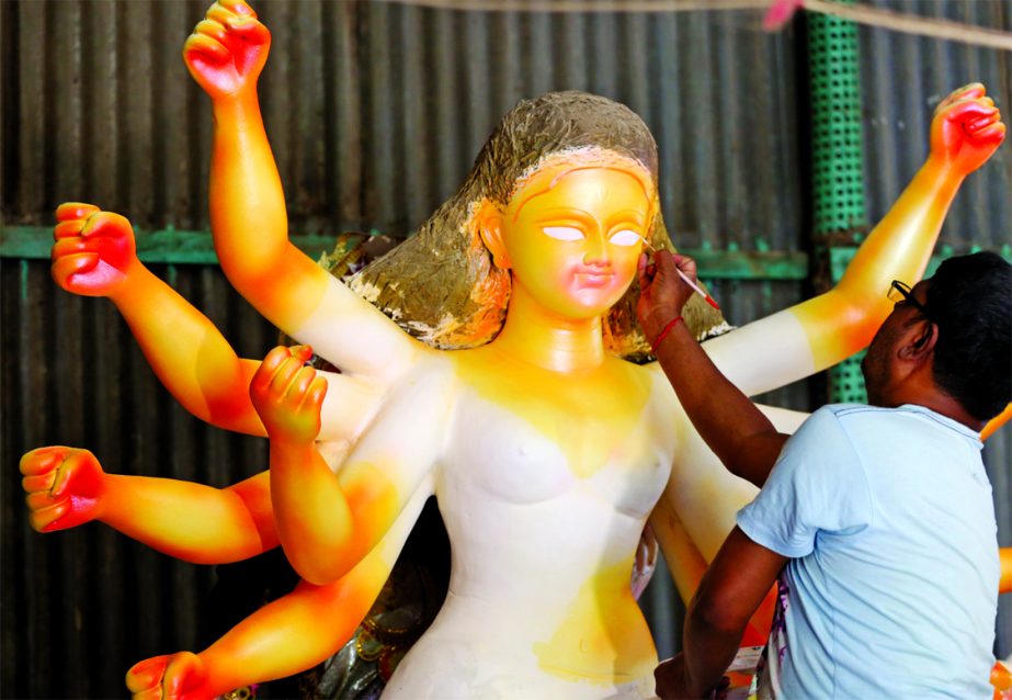 Sculptors are busy making statues of Hindu goddess ahead of the community's biggest Durga Puja festival. This photo was taken from the city's Banglabazar temple on Wednesday.