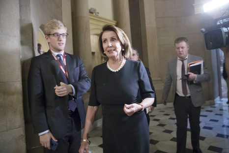 House Minority Leader Nancy Pelosi, D-Calif., leaves a meeting with Speaker of the House Paul Ryan, R-Wis., and members of the Congressional Hispanic Caucus at the Capitol in Washington.