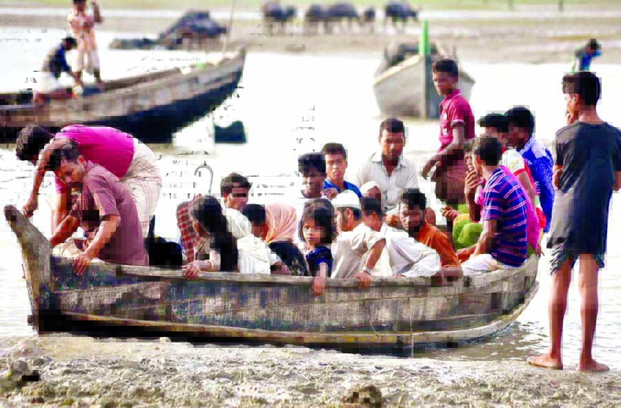 Thousands of Rohingyas continued to arrive by boat and on foot into Bangladesh. This photo was taken from Shahparir Island on Thursday.