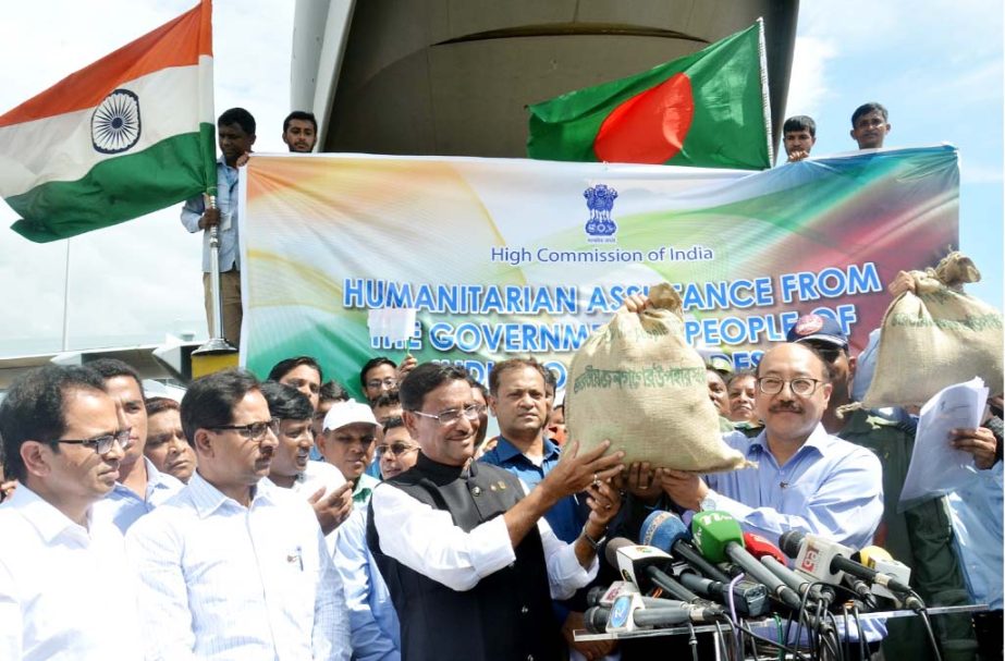 Minister for Road Transport and Bridges Obaidul Quader MP receiving relief goods for Rohingyas from Indian High Commissioner to Bangladesh Harsh Vardhan Shringla at Chittagong Shah Amanat Airport on Thursday.