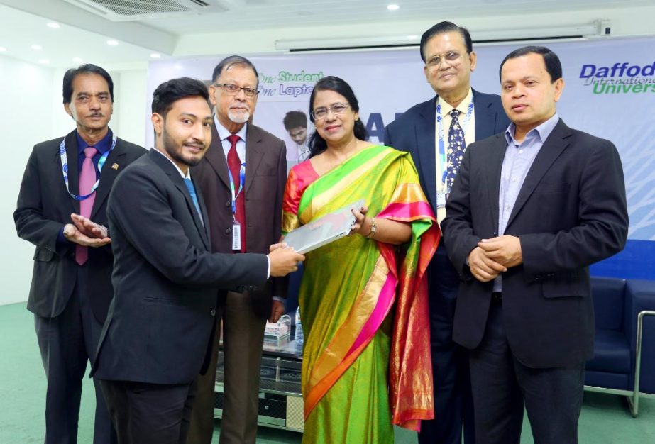 Prof Dr Dil Afroza Begum, Member, University Grants Commission of Bangladesh distributing laptops among the students under "One Student-One Laptop" project on Tuesday at 71 Milonayoton of the University in the capital.