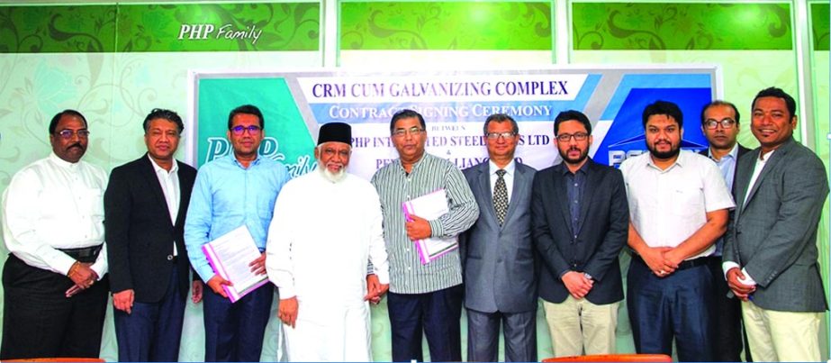 Mohammed Iqbal Hossain, Managing Director of PHP Family and Engr. Newaz Khan. Chairman of PEB Steel Alliance Limited, sign an agreement for 8400 tons steel recently. PHP Family Chairman Sufi Mohamed Mizanur Rahman, Vice Chairman Mohammed Mohsin, Director