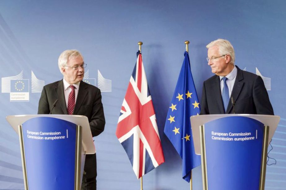 EU chief Brexit negotiator Michel Barnier, right, and British Secretary of State David Davis address the media prior to a meeting at the EU headquarters in Brussels on Monday.