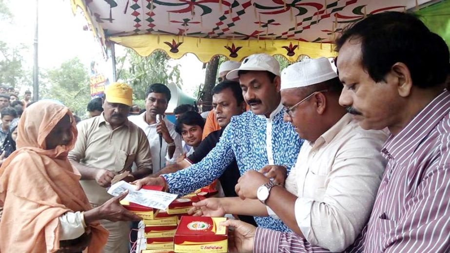 Pankaj Devnath MP distributing sweets among the Rohingya people at Ukhiya TV Relay Centre yesterday.