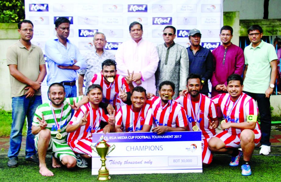 Players of Dhaka Tribune, the champions of the Kool-BSJA Media Cup Football Tournament with the guests and officials of Bangladesh Sports Journalists Association pose for a photo session at BFF Artificial Turf on Friday.
