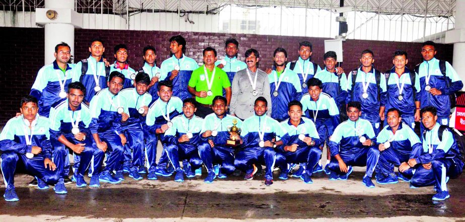 Members of Bangladesh Under-18 National Football team, the runners-up of the SAFF Under-18 Championship pose for photograph at the Hazrat Shahjalal International Airport on Friday.