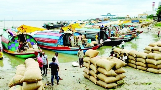 A view of the Ashuganj rice marker, in the bank of Meghna International River Port shows rice import activities on Saturday.