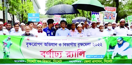 SYLHET :Brikhaprane Prokriti-Protibesh, Agami Projanmer Teksai Bangladesh jointly bring out a rally marking the 15 day-long divisional Tree Fair at Alia Madrasa ground premises of Sylhet City on Saturday.