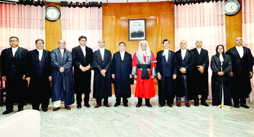 Chief Justice Hasan Foez Siddique is seen with eleven new additional judges to the High Court Division of Supreme Court at the Supreme Court Judges Lounge on Sunday.