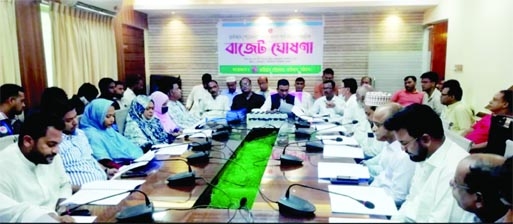 Mayor of Raozan Pourasava Jamiruddin Parvez announcing the annual budget for the financial year 2022-23 in the budget meeting at poura conference hall yesterday.