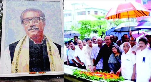 Rajshahi City Mayor AHM Khairuzzaman Liton accompanies by scores of leaders and workers places wreaths on the portraits of Bangabandhu and four other national leaders at the party's city unit office premises on Monday.