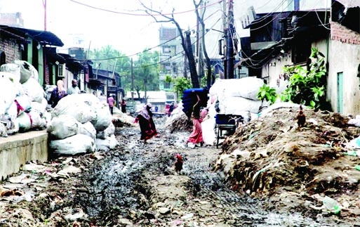 Garbage and waste materials dump on road at Shyampur industrial area in the capital, turning it a sorry state. This photo was taken on Monday.