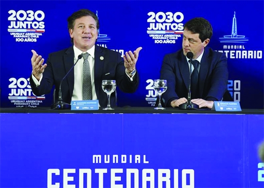 President of CONMEBOL, Alejandro Dominguez (left) speaks at a press conference for a joint bid to host the 2030 FIFA World Cup with the hope of bringing the global showpiece back to its first home, at Centenario Stadium in Montevideo, Uruguay on Tuesday.