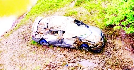 A smashed private car which fell into a canal beside a road along Sylhet-Tamabil Highway in Jaintapur upazila on Friday, leaving two people dead.