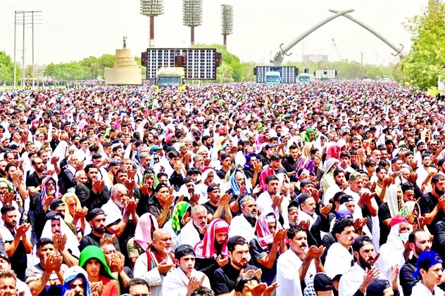 Supporters of Iraqi populist leader Moqtada al-Sadr gather for mass Friday prayers at Grand Festivities Square within the Green Zone, in Baghdad, Iraq.