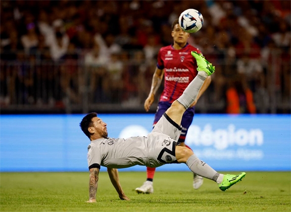 Paris St Germain's Lionel Messi scores their fifth goal against Clermont Foot 63 during the French L1 football match at Stade Gabriel Montpied in Clermont-Ferrand, central France on Saturday.