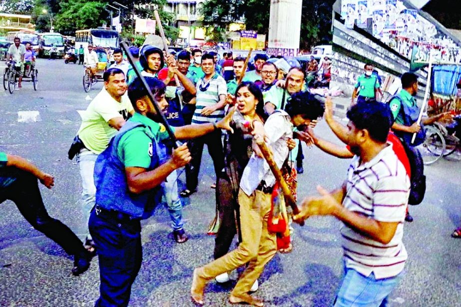 Police charge batons on activists of left-leaning student organisations during a rally called to protest against fuel price hike at Shahbagh intersection in the capital on Sunday. NN photo