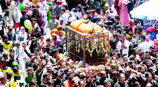 The Shia community in Old Dhaka brings out a Tajia procession on Tuesday marking the Holy Ashura after two years due to Covid pandemic.