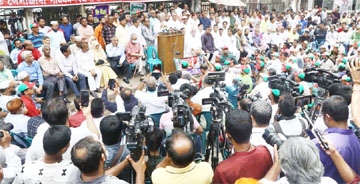 'Bangladesh Sammilita Peshajibi Parishad' forms a human chain in front of the Jatiya Press Club on Friday in protest against price hike of essentials including fuel.