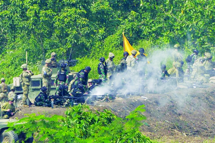 US and Indonesian soldiers engage targets with their heavy machine guns during Super Garuda Shield 2022 joint military exercises in Baturaja, South Sumatra, Indonesia on Friday.