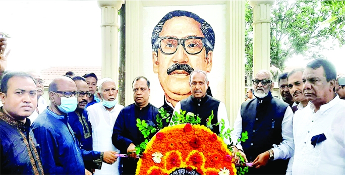 ISHWARDI (Pabna): Science and Technology Minister Architect Yeafesh Osman places wreath at the mural of Bangabandhu at Upazila Parishad premises on the occasion of the National Mourning on Monday.