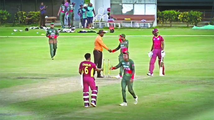 Cricketers of Bangladesh A team shake hands with umpire and players of West Indies A team after winning the second one-dayer at the Darren Sammy Stadium in Saint Lucia on Thursday.