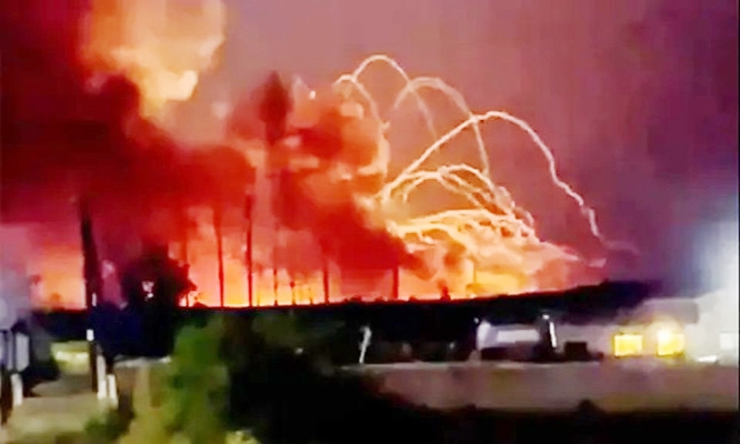 Russian ammunitions depot ablaze near Ukraine border.