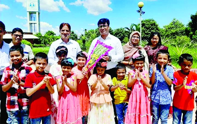 SYLHET: Mojibor Rahman, DC Sylhet greets children of SOS Shishu Palli Sylhet at Dayamir Union of Osmaninagar Upazila during his visit recently.