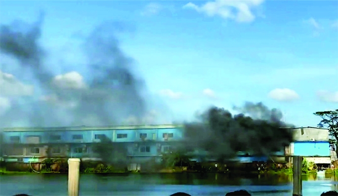 Black flame billows as a massive fire broke out at a shoe factory in BSCIC industrial area of Barishal on Saturday.