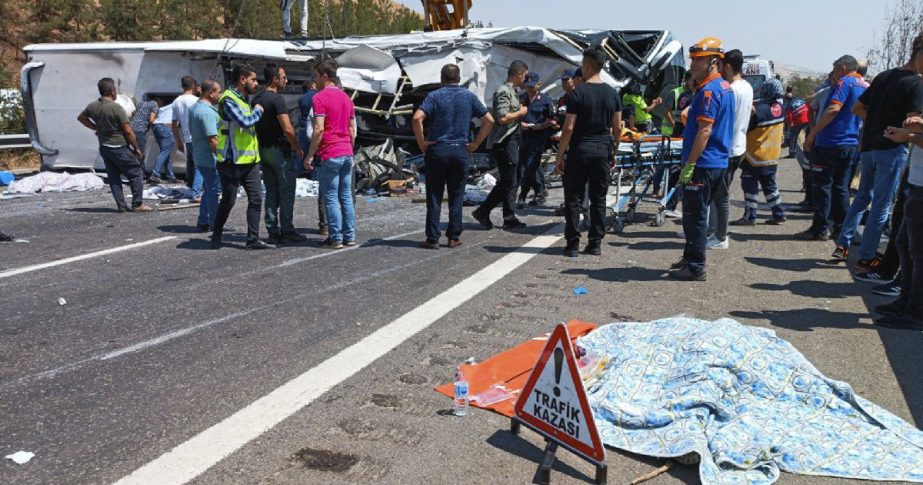 Emergency and rescue teams attend the scene after a bus crash accident on the highway between Gaziantep and Nizip, Turkey, Saturday, Aug. 20, 2022.