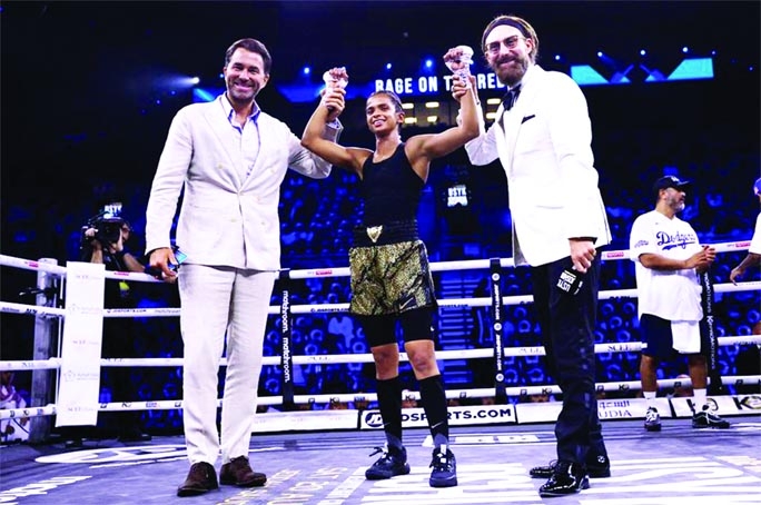 Ramla Ali (center) celebrates winning her fight against Crystal Garcia Nova at King Abdullah Sports City Arena, Jeddah, Saudi Arabia on Saturday.