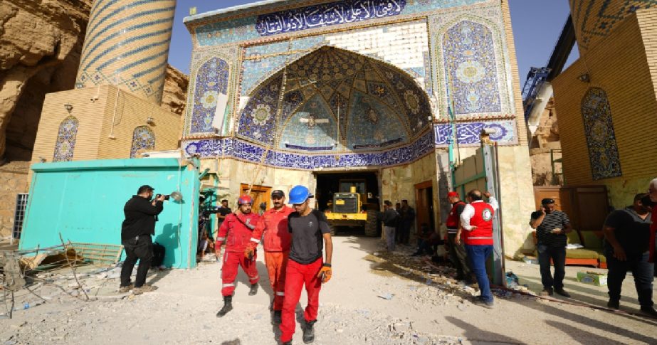 mergency services and rescue workers are seen at Qattarat al-Imam Ali shrine near Karbala, Iraq, Sunday, Aug. 21, 2022.