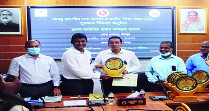 CHANDPUR: Md Kamrul Hasan, DC, Chandpur hands over crest, gift to eminent scholar Prof Md Masudur Rahman, Principal of Chandpur Govt Mohila College at DC Conference Room on Thursday as the College has selected the best Institute recently.