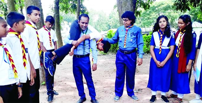 MANIKGANJ : Singair Govt High School Scout Group organizes a weekly troop meeting on Tuesday. Mohammad Akram Hossain, Group President of the school, visited the activities of the troop meeting.