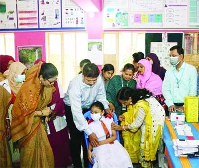 SYLHET: A primary student aged 5-11 years receives Pfizer Covid-19 vaccine from Sylhet City Corporation's health department at the Govt Kindergarden Primary School on Thursday.