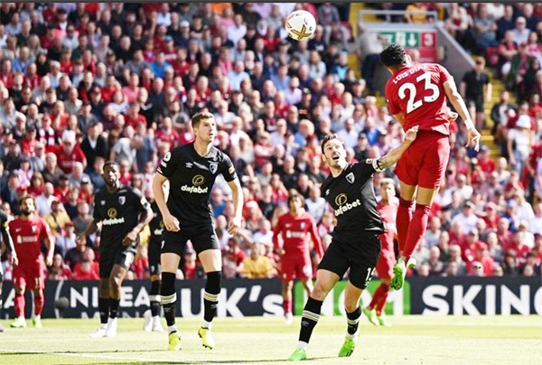 Liverpool's Colombian midfielder Luis Diaz (right) jumps to head for the opening goal of the English Premier League football match against Bournemouth at Anfield in Liverpool, northwest England on Saturday.