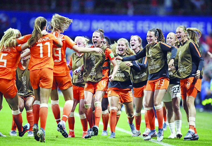 Dutch players celebrate after Netherlands' Lieke Martens scored her side's second goal from the penalty spot during the Women's World Cup round of 16 soccer match between the Netherlands and Japan at the Roazhon Park, in Rennes, France on Tuesday.