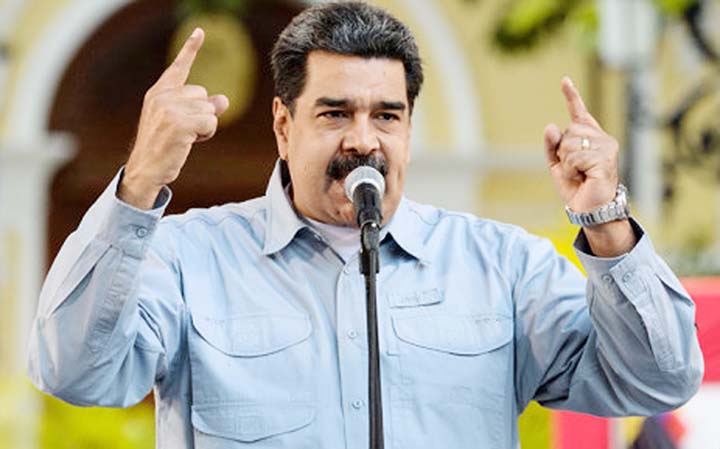 Venezuelan President Nicolas Maduro delivers a speech on the Signature campaign launched to urge the United States' to put a halt to intervention threats against his government, at Bolivar Square in Caracas