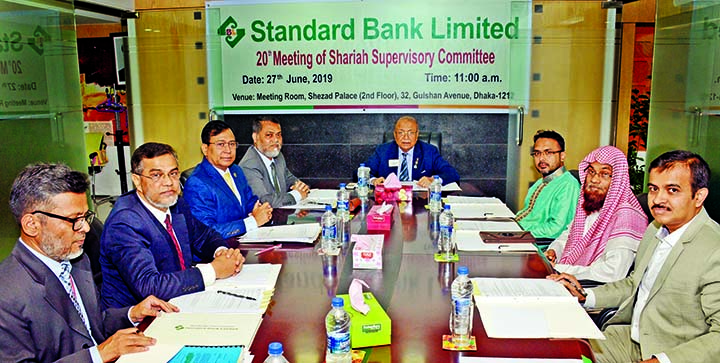 Kazi Akram Uddin Ahmed, Chairman of Standard Bank Ltd, presiding over its 20th Shariah Supervisory Committee Meeting at its meeting room on Thursday. Kazi Khurram Ahmed, Dr. Muhammad Saifullah, members of the committee and Managing Director of the Bank Ma